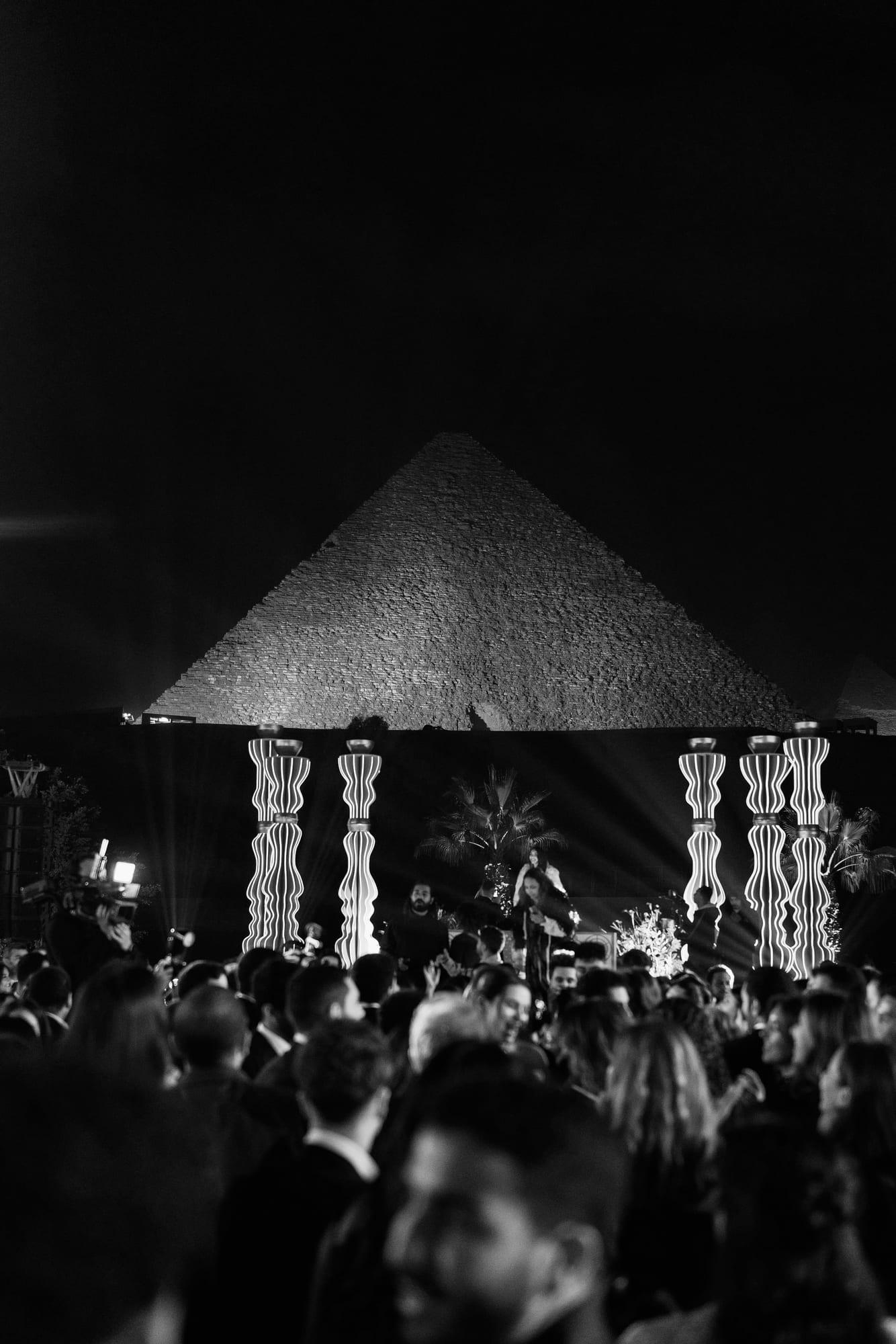 Wedding reception at night beneath the Pyramids of Giza, Cairo